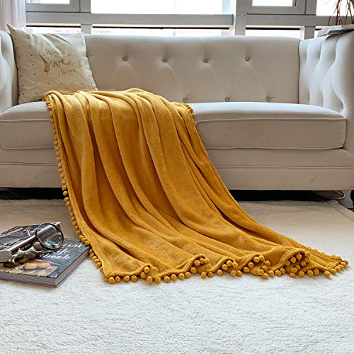 LOMAO Manta de franela de forro polar con pompones, manta para silla de cama individual, manta de microfibra súper suave, mullida y acogedora para oficina y sala de estar (amarillo, 150 x 200)