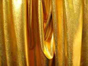 Tela elástica de lycra para disfraz, color dorado brillante, de Fabrics Online